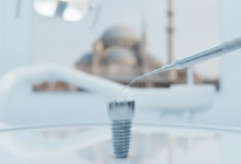 A photorealistic close-up of a modern, sterile dental setting showing a titanium dental implant on an anatomical model, with precision tools nearby. In the softly blurred background, a traditional Turkish architectural silhouette is subtly visible, hinting at the location.