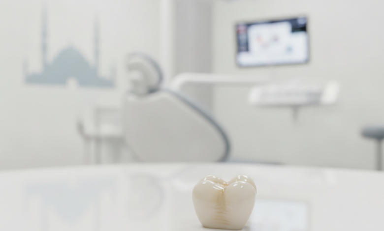 A photorealistic close-up of a perfectly crafted, natural-looking dental crown on a sterile surface. In the blurred background, a modern dental clinic and a subtle, iconic architectural silhouette of Istanbul, Turkey.