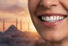 A person with a confident and healthy smile, showing bright, perfectly aligned teeth. In the soft-focus background, the iconic cityscape of Istanbul, Turkey, with its architectural landmarks under warm, ambient light.