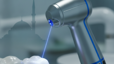 A photorealistic image of a futuristic dental laser handpiece emitting a precise light beam towards a generic tooth or gum, rendered in ultra-detail with a shallow depth of field. The background is a softly blurred modern dental clinic, with a very subtle, distant outline of Turkish architecture. No visible text.