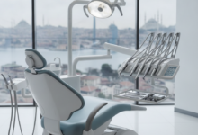 A photorealistic depiction of a pristine, modern dental clinic interior, featuring an ergonomic dental chair and neatly arranged sterile instruments. The background is a softly blurred panoramic view of the Istanbul skyline, suggesting dental tourism in Turkey.